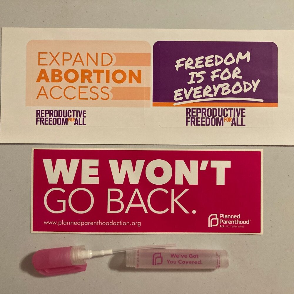 Planned Parenthood Stickers and Empty Hand Sanatizer